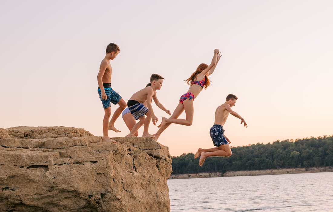 Kids jumping into a lake at Table Rock Lake, Missouri