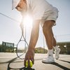 Senior man playing tennis