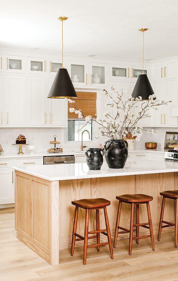 Kitchen with vases on breakfast island.