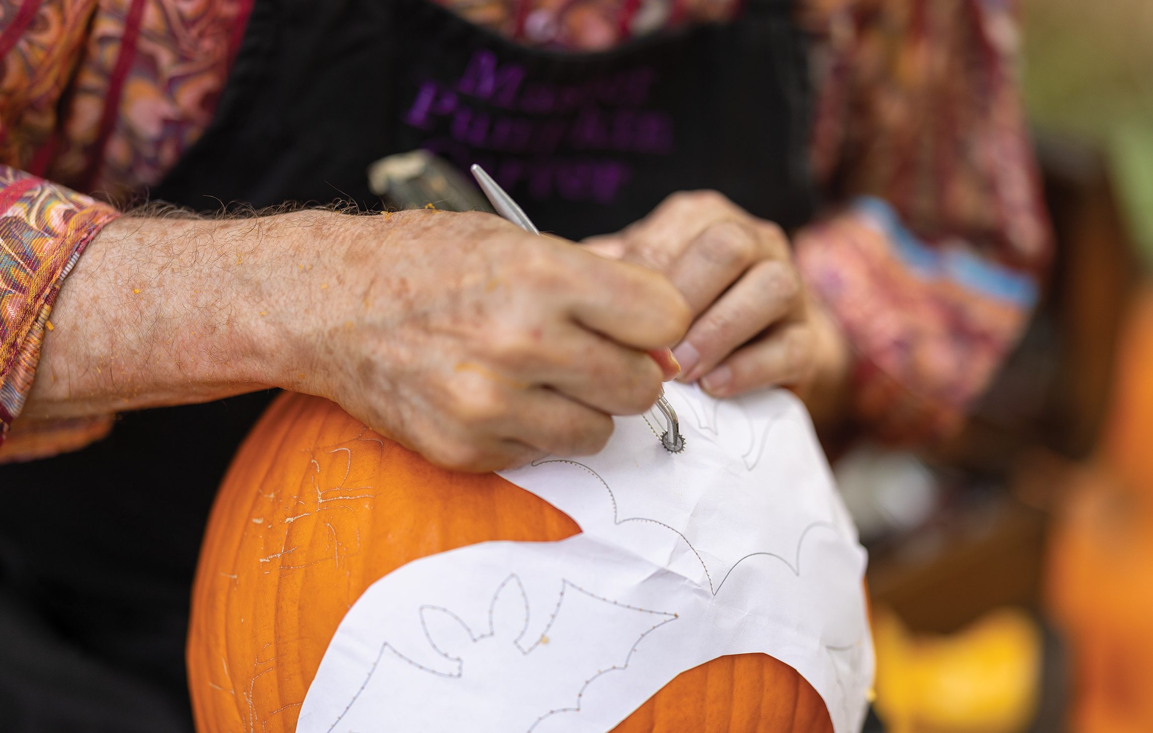 Barry Brown carving a pumpkin
