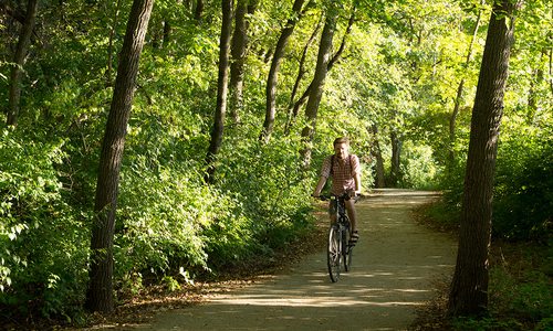 Man riding a bike on the Galloway Creek Greenway in Springfield MO