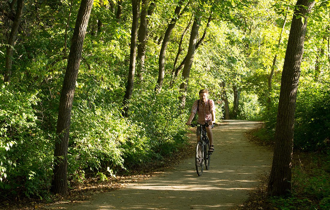 Man riding a bike on the Galloway Creek Greenway in Springfield MO