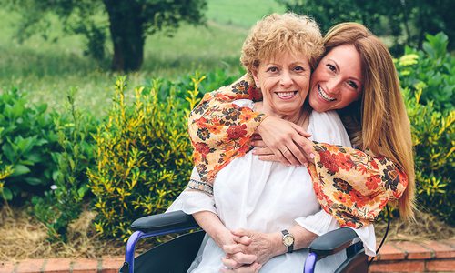 Adult mother and daughter in a garden