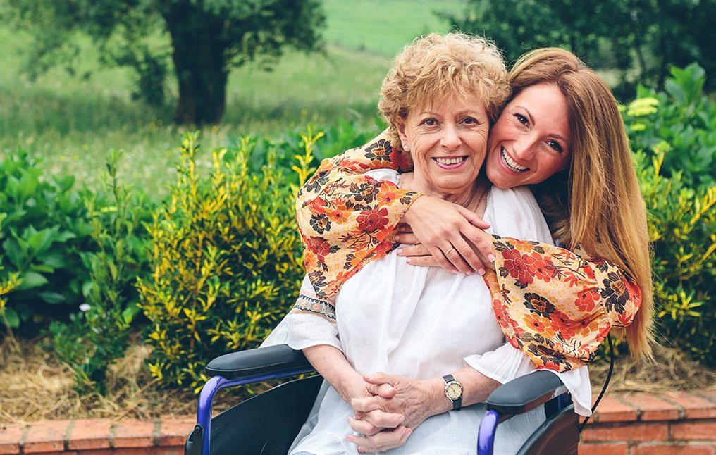 Adult mother and daughter in a garden