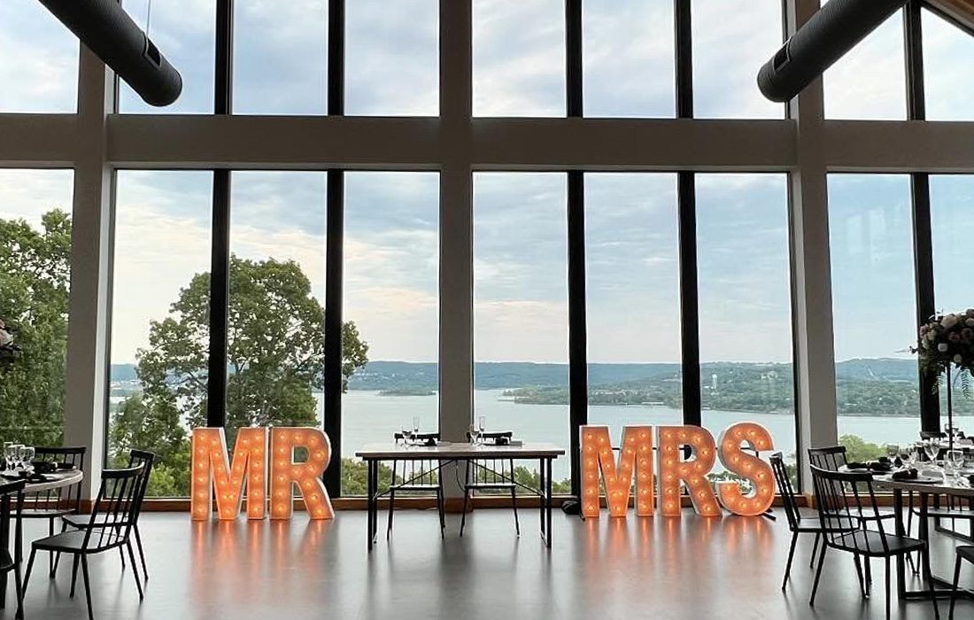 Mr. and Mrs. sign by Alpha Lit.