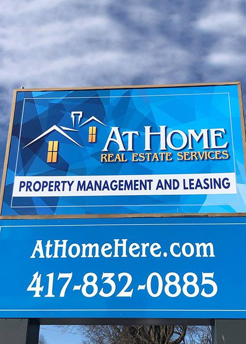 At Home Real Estate Services sign in Springfield, MO