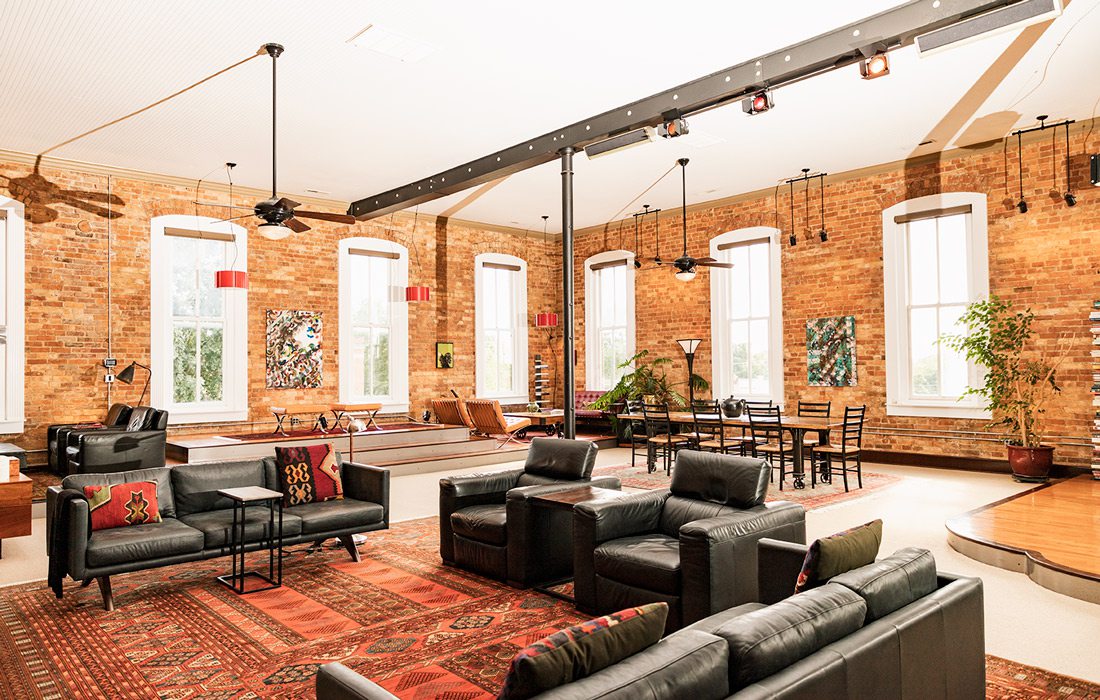 living room with black leather couches