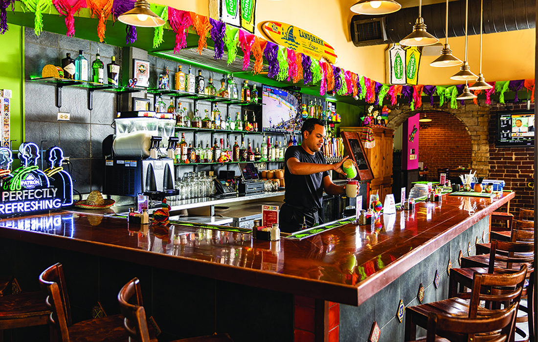 A bartender mixing a drink.