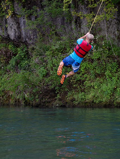 Rope swing on the Jack's Fork River in Missouri