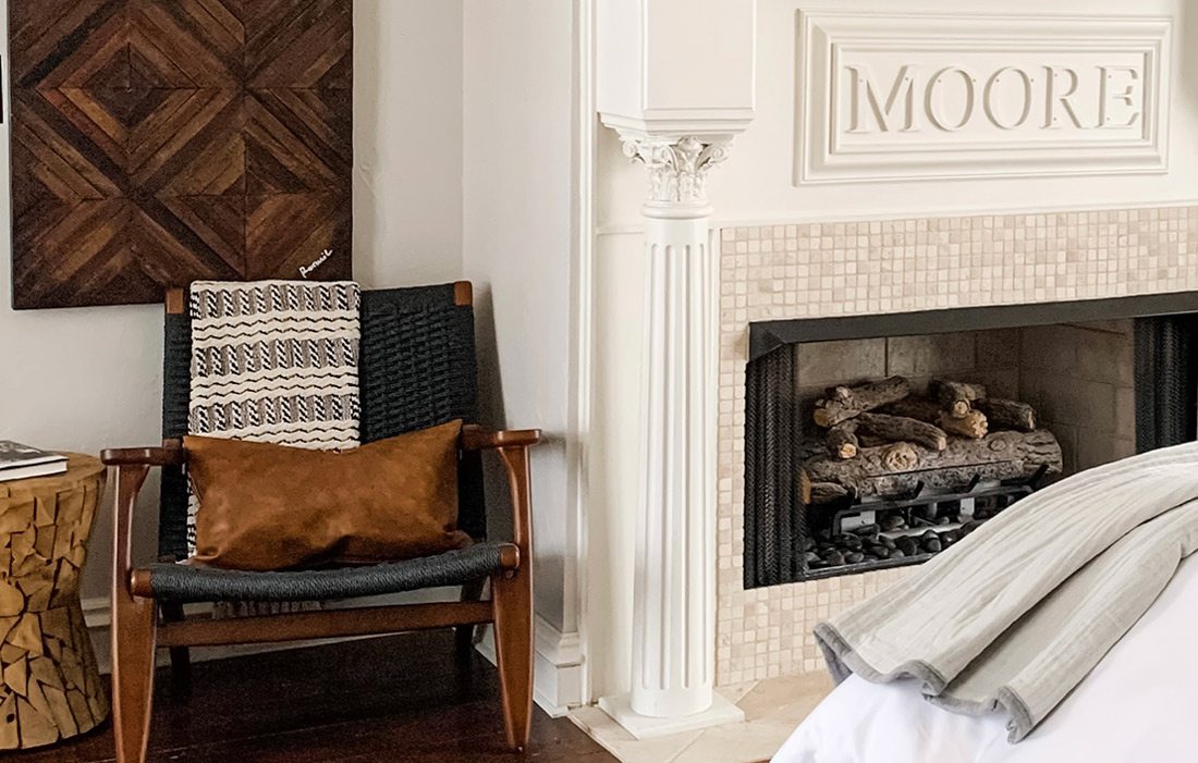 Fireplace and chair in bedroom that won Best Bedroom award