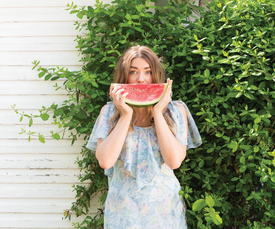 woman with a slice of watermelon
