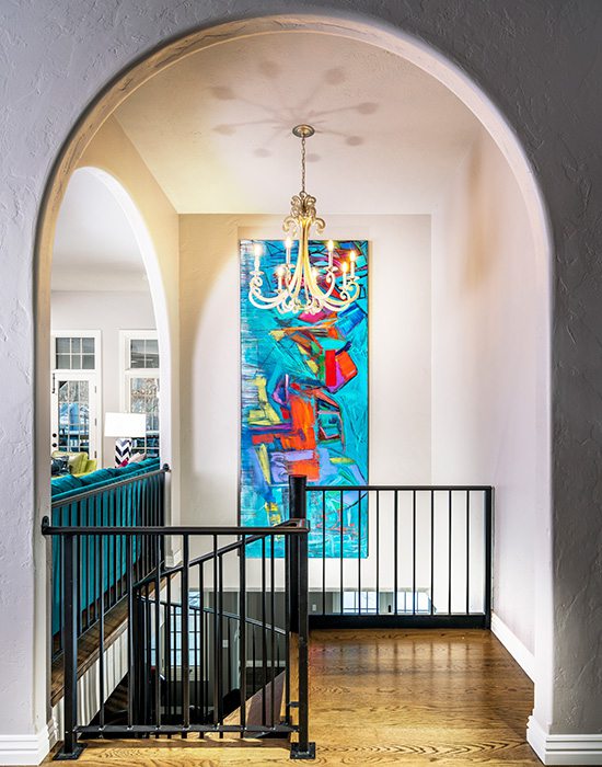 Painting by Betty Parnell hanging in a home designed by Obelisk Home