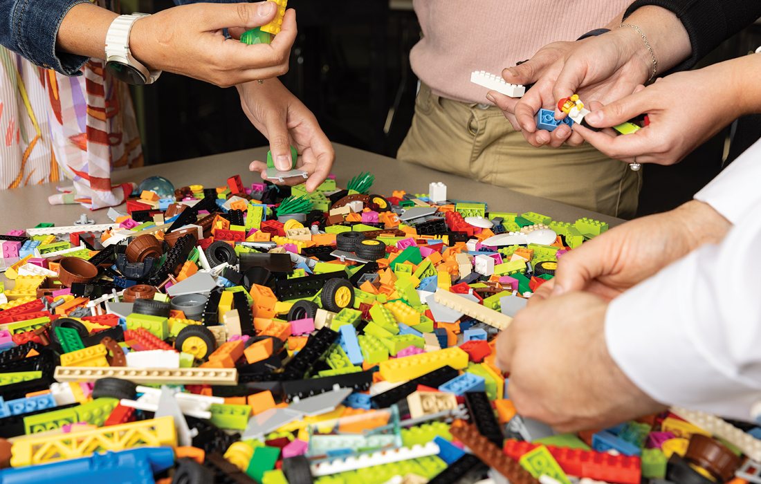 People using Lego bricks.