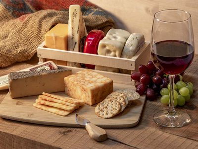 Charcuterie board and a glass of wine.