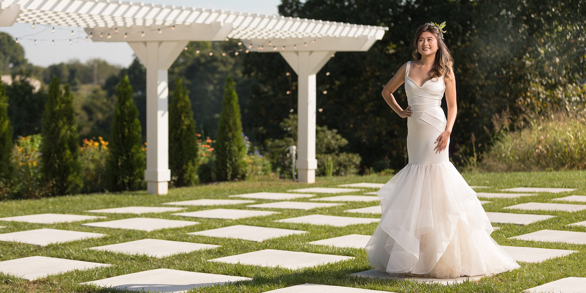 Ivory trumpet mermaid dress with tulle at Tesori Bridal Springfield MO