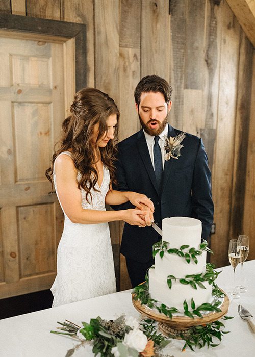 Brian Horton & Cheyann Weinacht cutting their wedding cake