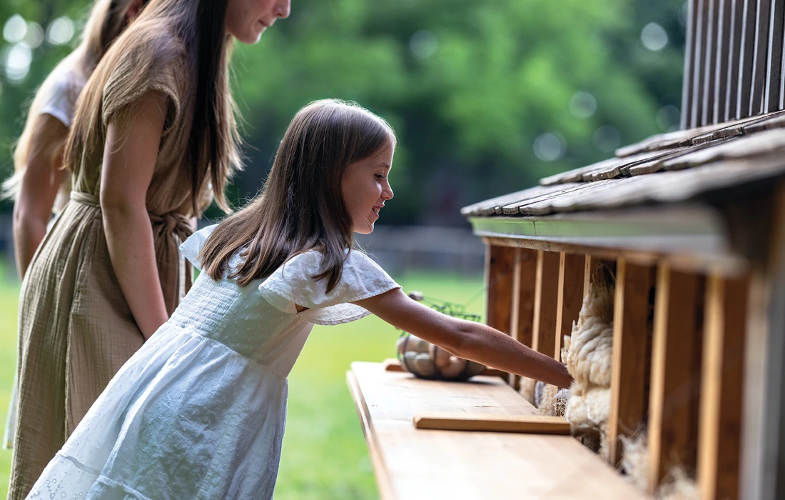 Girl at chicken coop