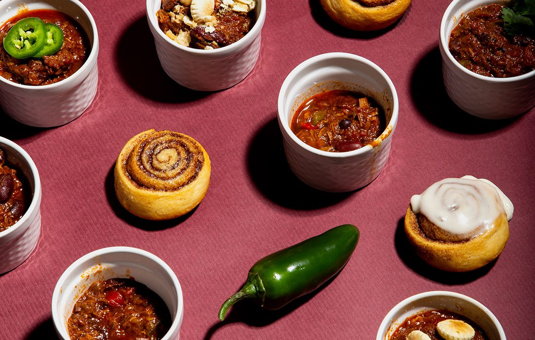 Bowls of chili and cinnamon rolls