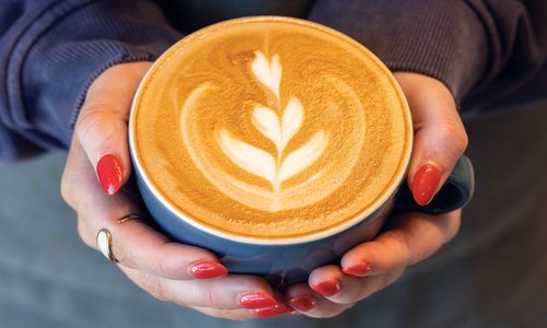 Coffee cup held in hands