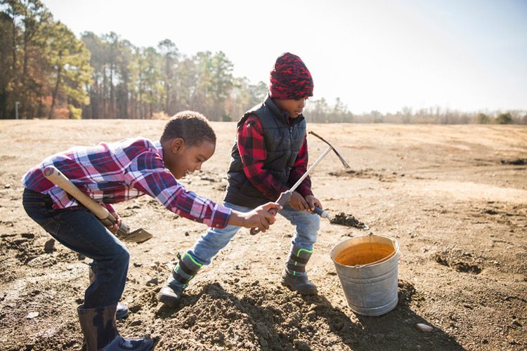 Kids collecting sand at Crater of Diamonds, Arkansas