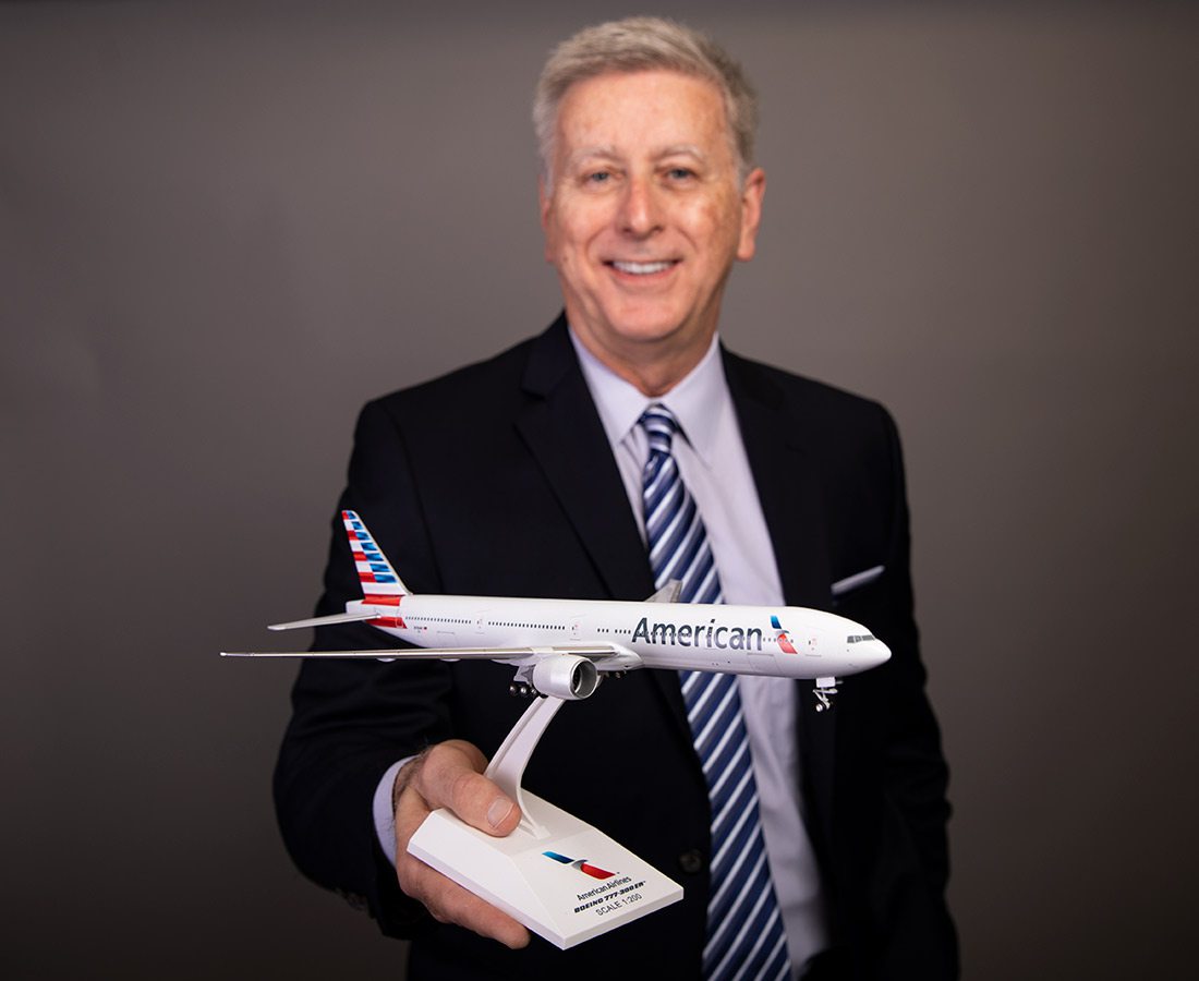 David Agee holding model American Airlines airplane