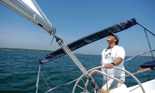 Erik K. Peterson sailing on a lake.