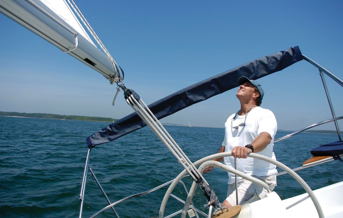 Erik K. Peterson sailing on a lake.