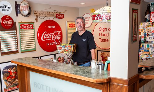 Brian VanFosson with classic Coca-Cola merchandise collection.