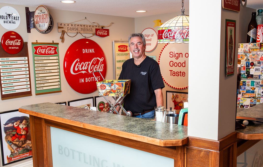 Brian VanFosson with classic Coca-Cola merchandise collection.