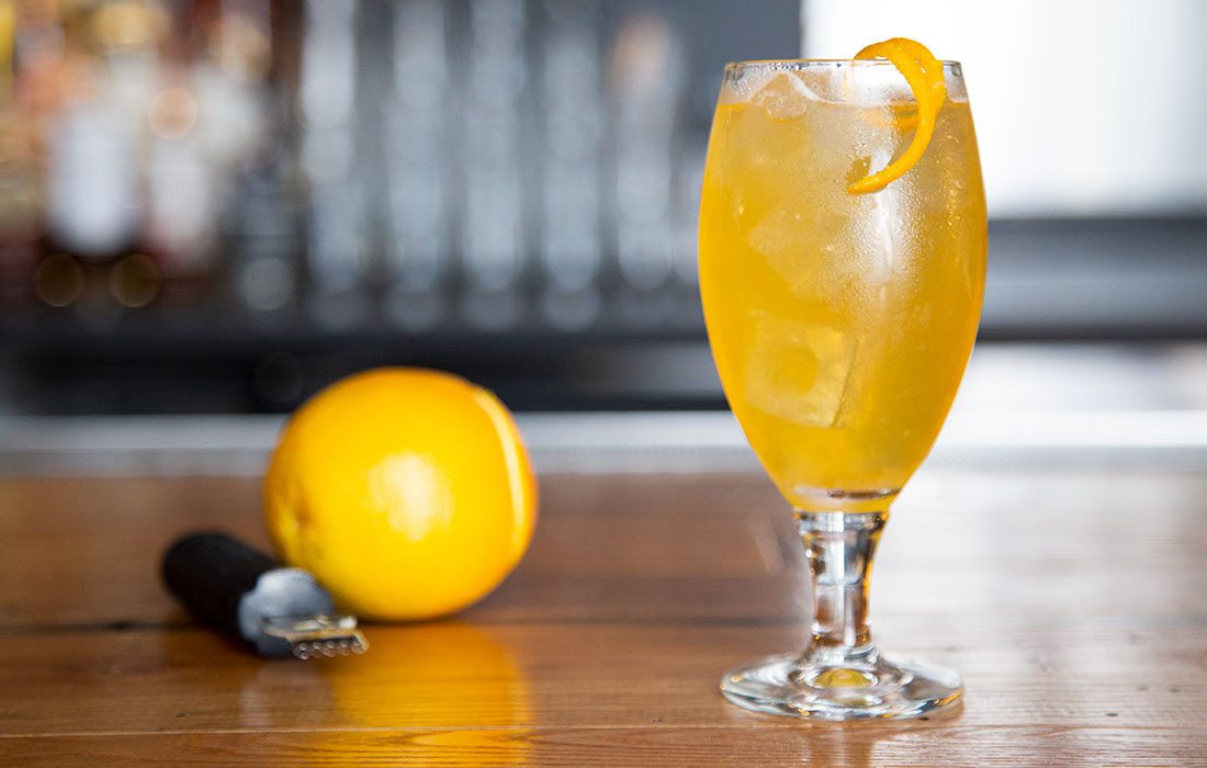 yellow alcoholic drink with lemon