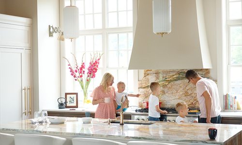 Erica Lea in her kitchen with her family.