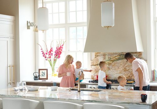 Erica Lea in her kitchen with her family.