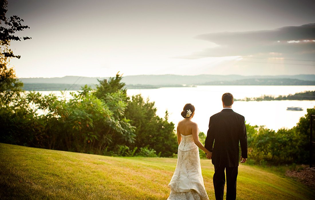 Bride and groom overlooking Table Rock Lake at Chateau on the Lake in Branson MO