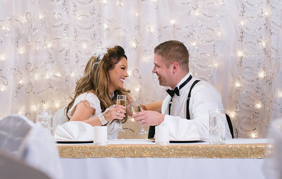 Bride and groom sharing a champagne toast at Pointe Royale Golf Village in Branson MO