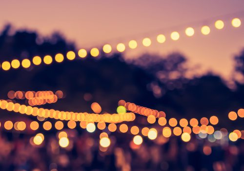 glowing string lights at sunset