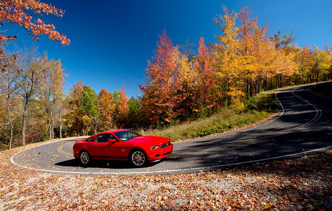 Red sport car on the Pig Trail Scenic Byway in Arkansas