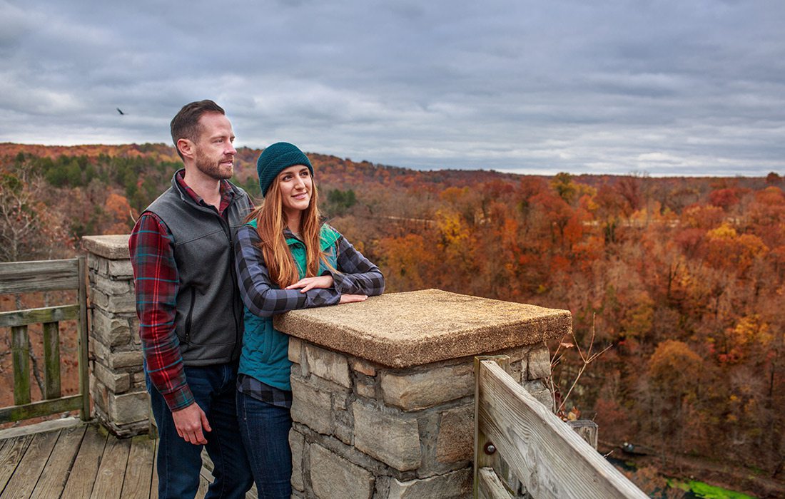 Young couple at an outlook stop along the Ha Ha Tonka loop trail in Camdenton, Missouri