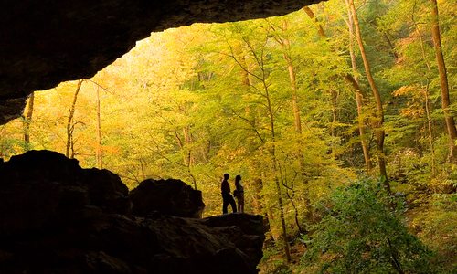 Couple silhouetted in Edens Fall Cave