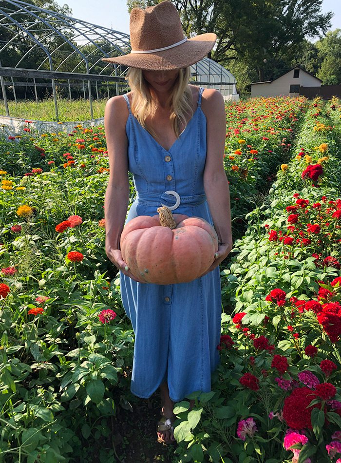 Heather Kane carrying pumpkin.