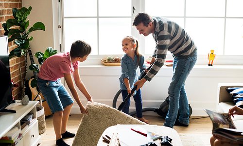 Father and kids cleaning at home