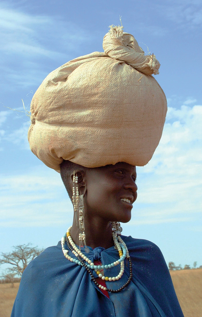 Woman with bag of grain