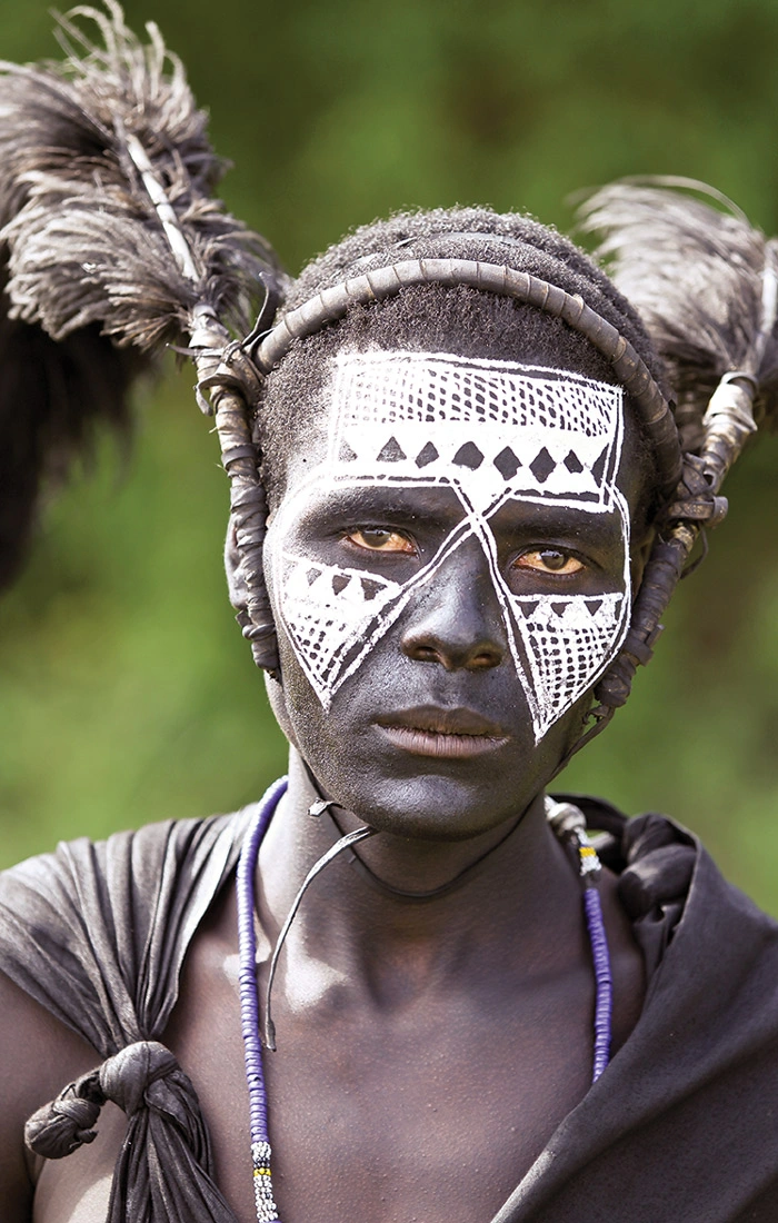 Teenage boy with elaborate white markings face