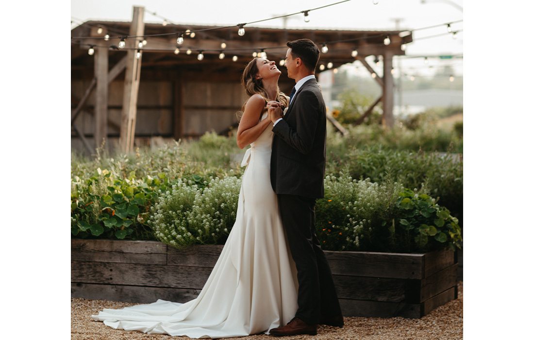 Bride and groom amongst the lights at Finley Farms.