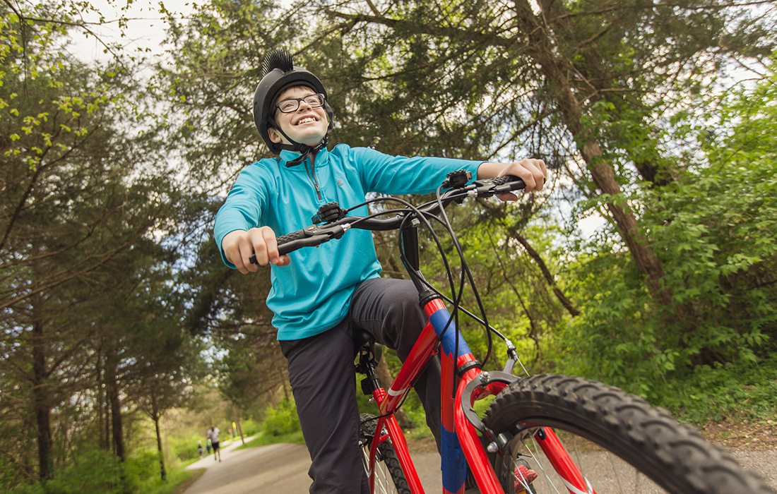 Young boy riding a bike on the Galloway Trail