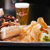 BBQ sandwich with chips and a beer at Gettin' Basted in Branson MO