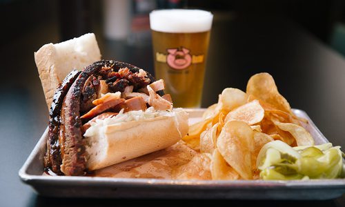 BBQ sandwich with chips and a beer at Gettin' Basted in Branson MO