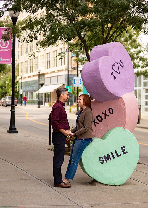 Couple with a sculpture on Sculpture walk Springfield MO