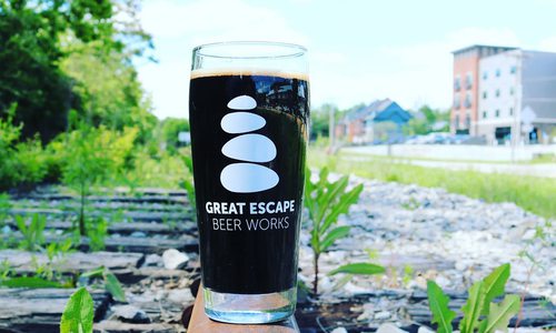 Great Escape Beer Works stout beer on train tracks in Galloway