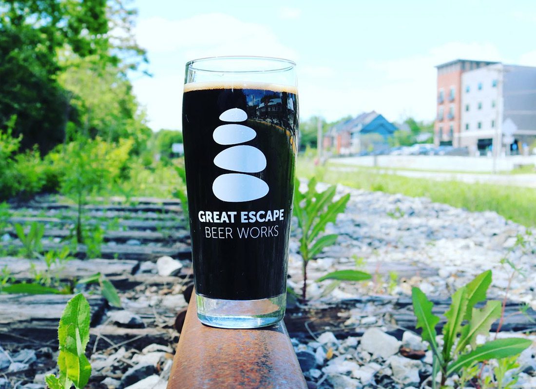 Great Escape Beer Works stout beer on train tracks in Galloway