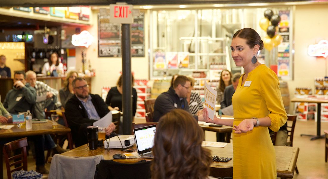 Katie Davis, coach for The Great Game of Business, teaches five small businesses about a new pilot program.